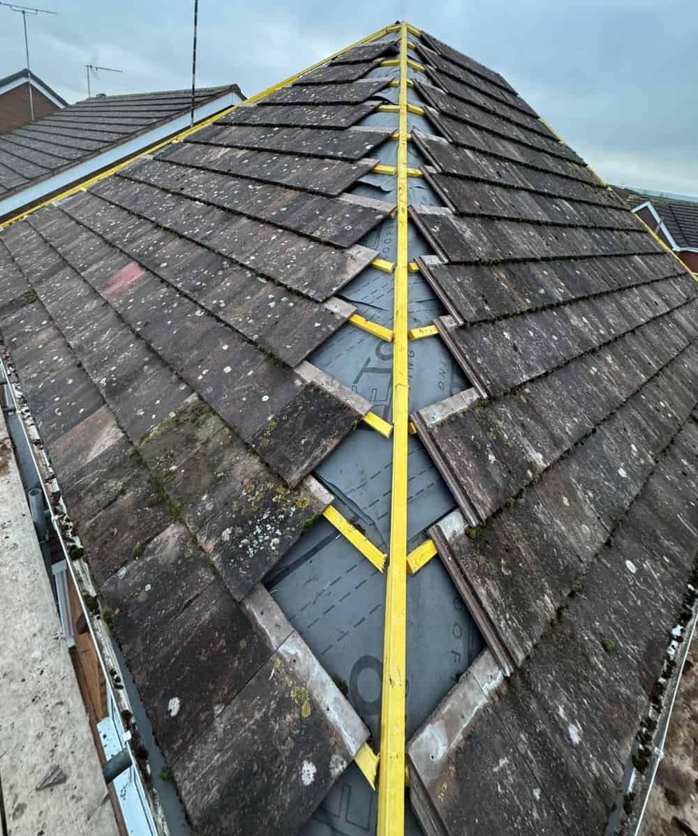 Roof repair in progress on a residential property